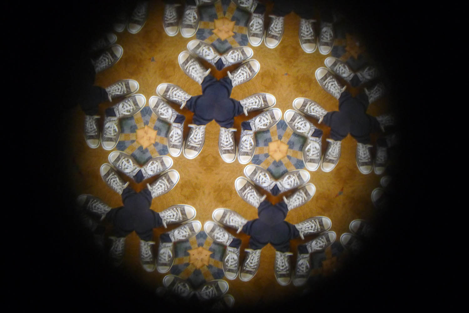 Looking through a kaleidoscope with a glass end